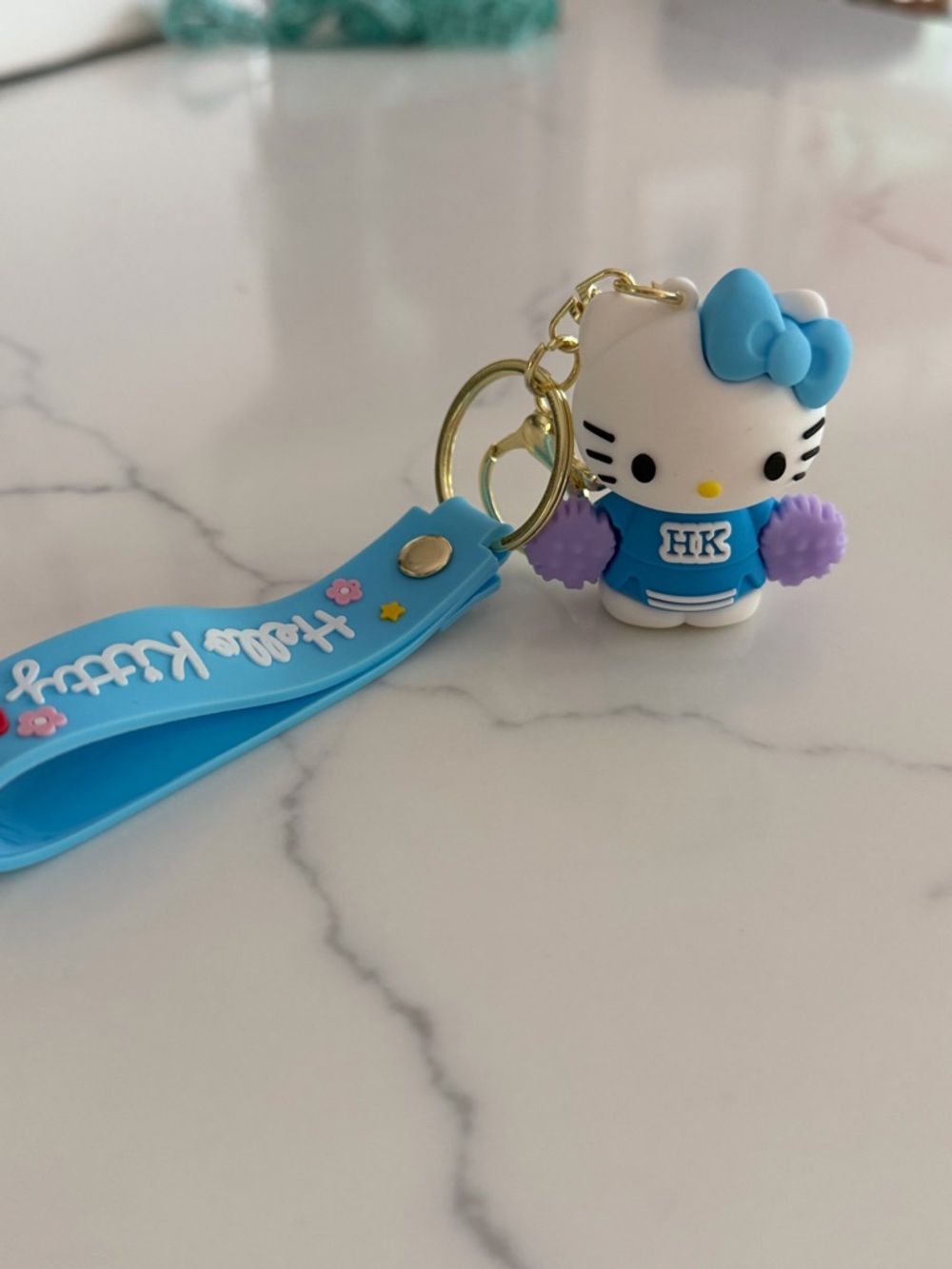 Hello Kitty Blue Cheerleader Keyring with Purple Pom-Poms and Blue Wrist Strap